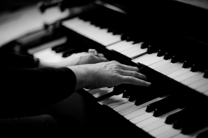 woman playing organ