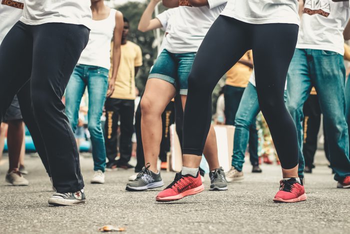 people dancing in street