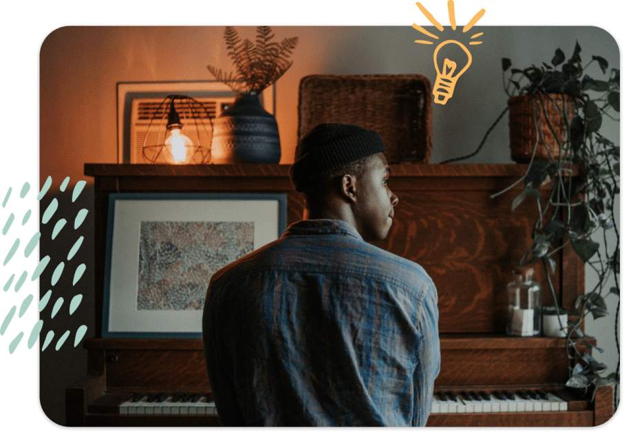 man at wooden upright piano