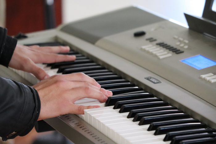 hands on a gray keyboard